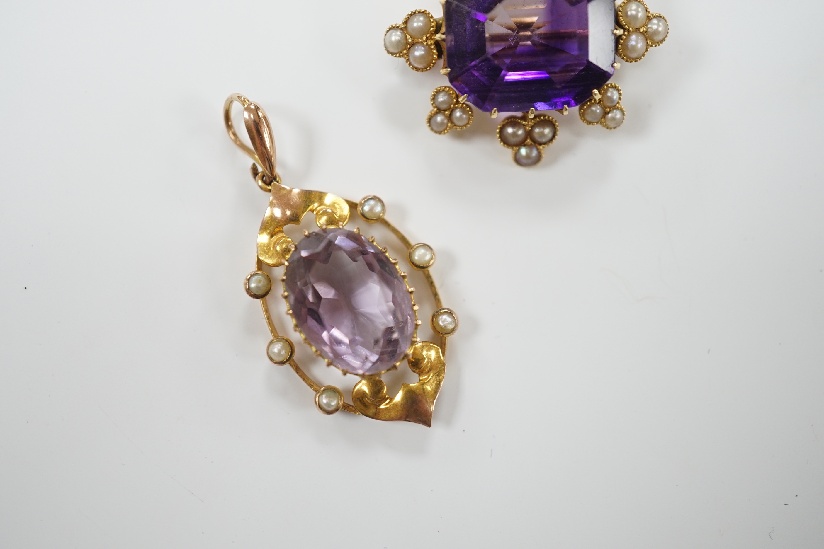 An early 20th century yellow metal, amethyst and seed pearl set brooch, 26mm and a similar pendant, gross weight 9.9 grams.